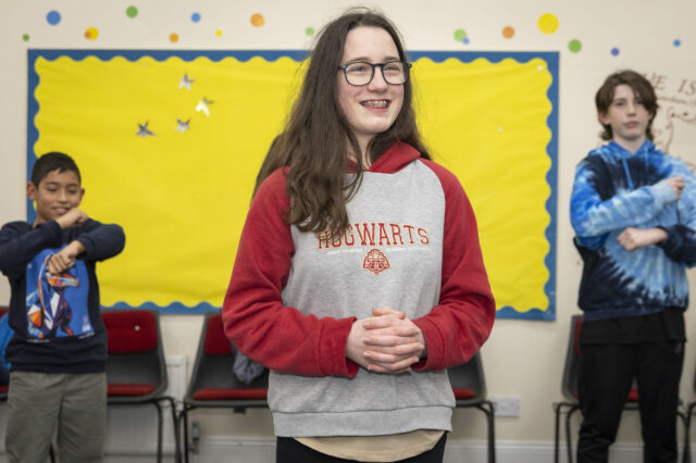 A young person smiling during activities at KoGs Youth Club in Lanchester.