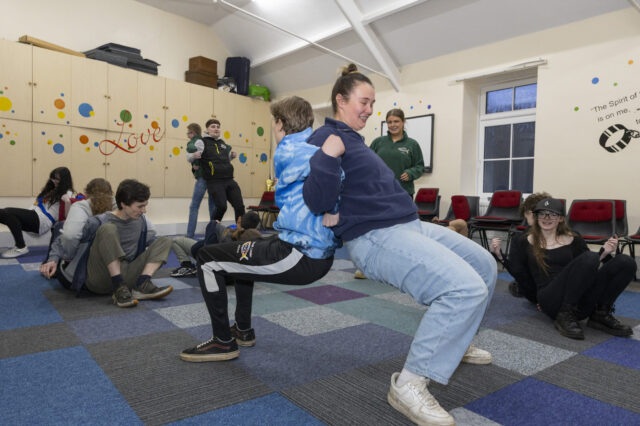 Young people taking part in team games at KoGs Youth Club.
