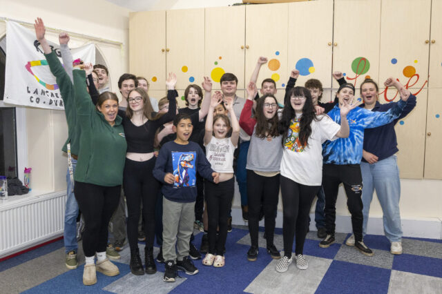Young people and youth leaders at KoGs Youth Club in Lanchester celebrating together.