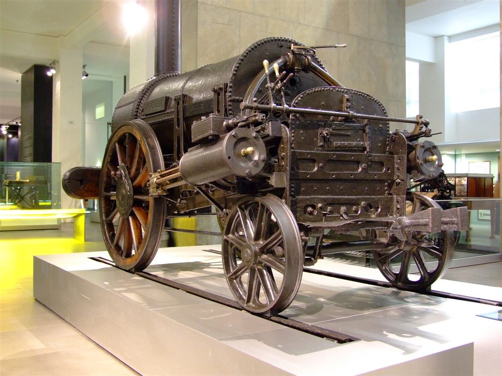 A closer view of the genuine Stephenson Rocket, designed by George Stephenson, whose Locomotion No. 1 first ran at Heighington station, marking the start of modern railway history.
