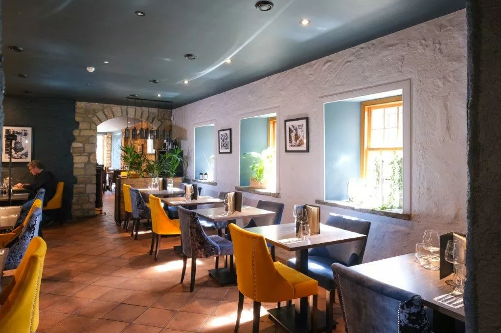 Jack explained that the restaurant had been given a breathtaking new interior look, designed by Bryan, featuring a stunning wooden wall, new furniture, and atmospheric shots on the wall of the proud father and son together in the kitchen.