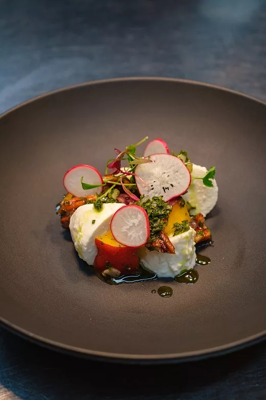 Iberian black pig with red onion salsa & sautéed potatoes. A variation sees the pig chargrilled with salt & pepper & barbecue sauce, served with apple slaw.