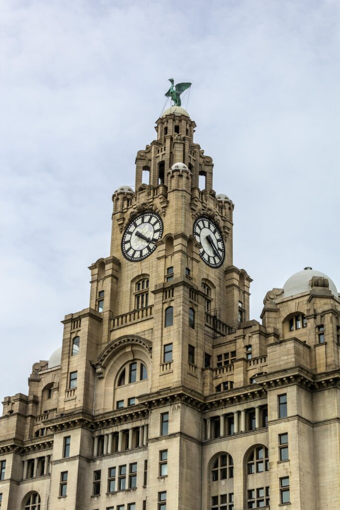 Close-up view of the Royal Liver Building clock tower with Liver Bird statue in Liverpool.