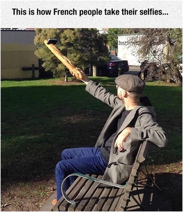 Man using baguette as a selfie stick