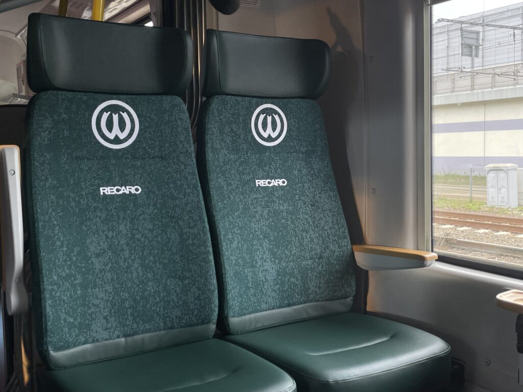Green seats inside the Warciarz wagon
